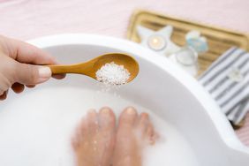 Putting epsom salts in a foot bath