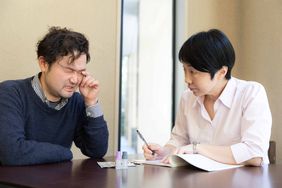 Patient talking to doctor about eye