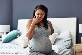 pregnant person experiencing nausea and vomiting