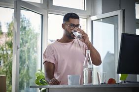 man drinking water