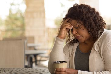 African American middle age woman looking sad