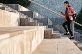 woman walking up stairs