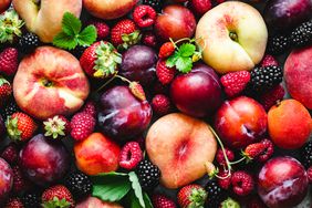 Image of various stone fruits: peaches, plums, apricots, raspberries, blackberries
