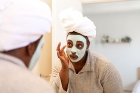 a person applying a face mask