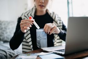 Woman holding a medical test tube