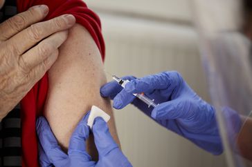 Older adult getting COVID vaccine
