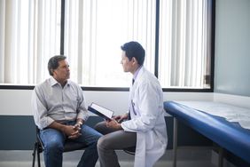 male physician talking to male patient