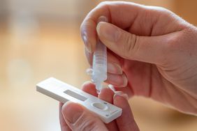 A woman takes a COVID test.