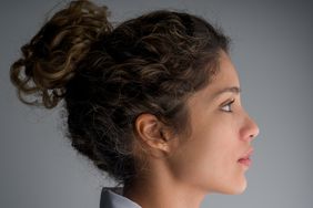 Profile portrait of a Latin American female doctor - healthcare and medicine concepts