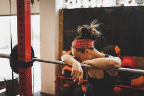woman at gym sad
