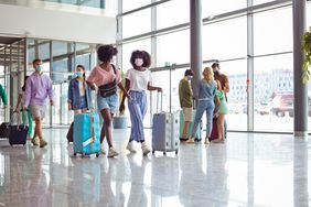 people traveling wearing masks