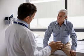 Doctor talking to patient about rhinophyma