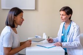 Genital herpes - Patient explaining symptoms to doctor