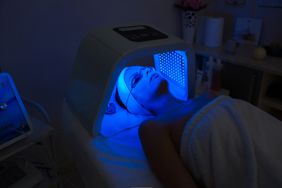 Woman having Ultraviolet LED light facial treatment