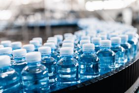 bottles of water on water bottling line