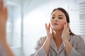 Woman looking in the mirror