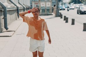 HS flare-up, person sweating outside in hot weather