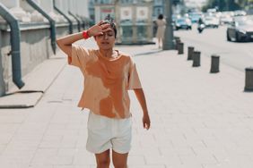 HS flare-up, person sweating outside in hot weather