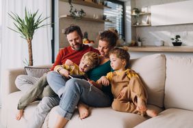 family sitting on couch