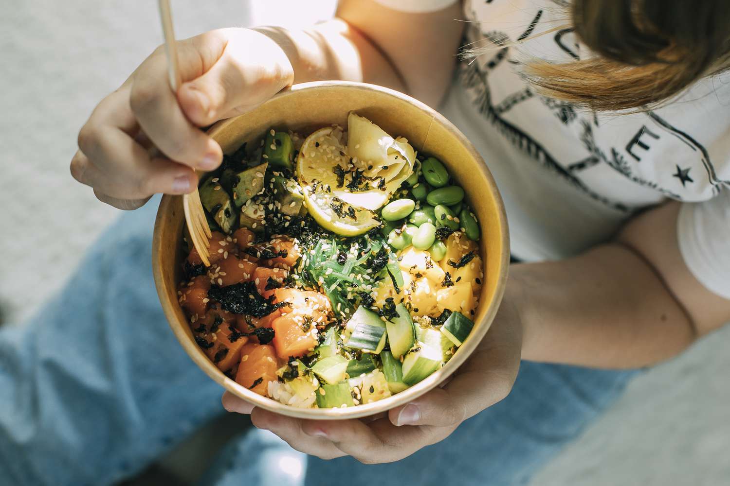 poke bowl with salmon, rice, seeds