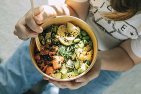 poke bowl with salmon, rice, seeds