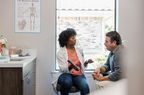 Doctor shows test results to a patient. 