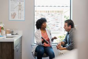 Doctor shows test results to a patient. 