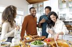 Friends cooking together