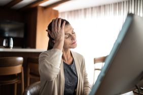 person experiencing headache on the right side
