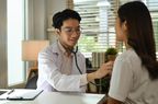 Doctor holding stethoscope examine checking heart lungs of patient in hospital. Medical care, healthcare and people concept.