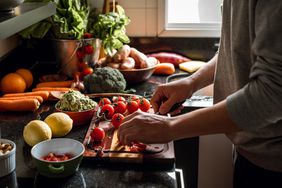 person preparing vegetables
