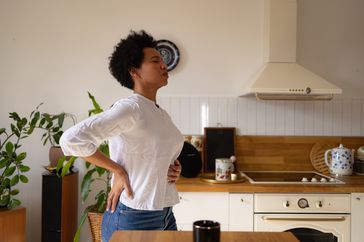 Person deep breathing for heartburn