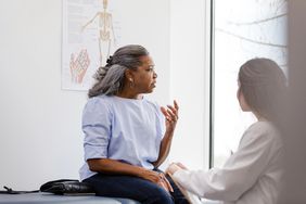 confused senior woman speaking to doctor