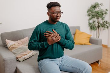 a man holding his chest