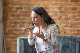 Angry woman shouts into the telephone