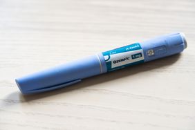 An Ozempic injection pen on a table.