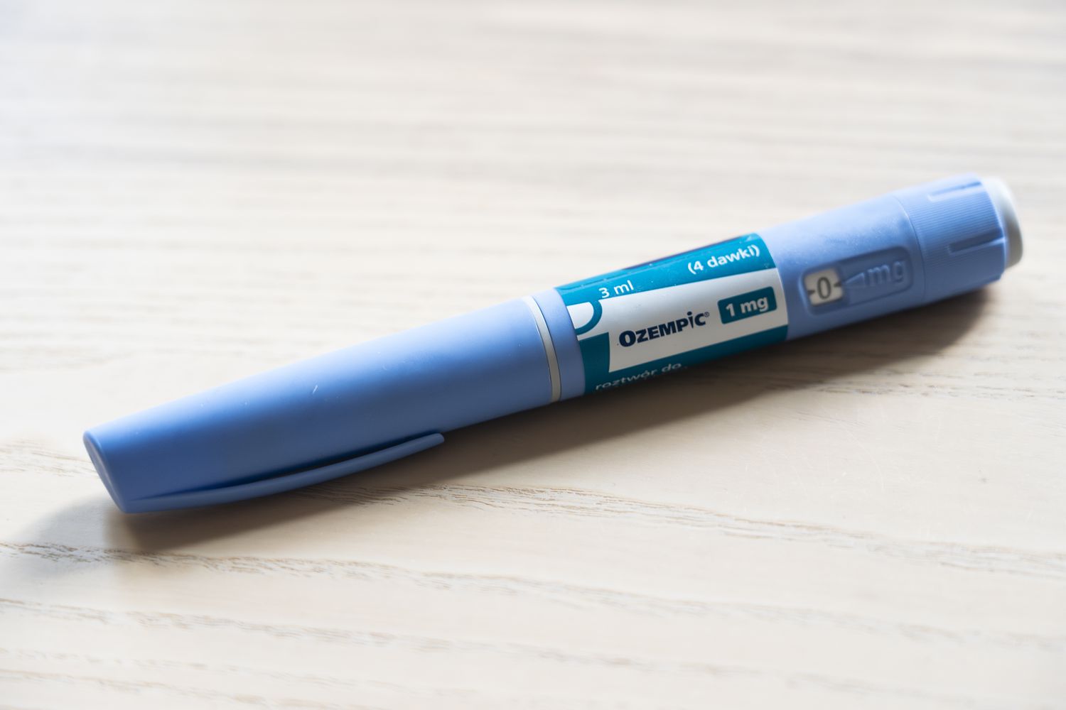 An Ozempic injection pen on a table.