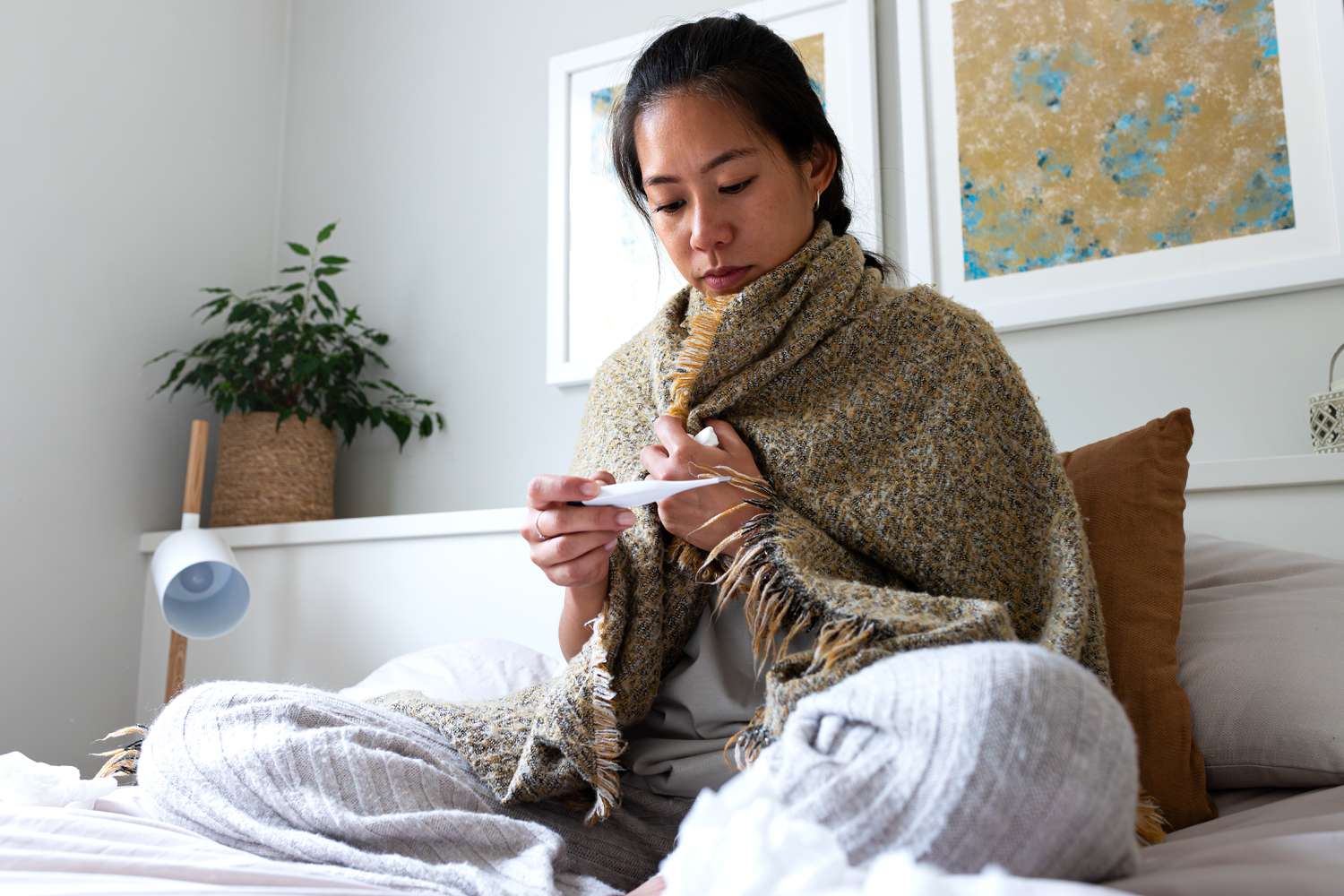 woman taking temperature