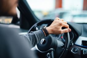 Man driving a car.