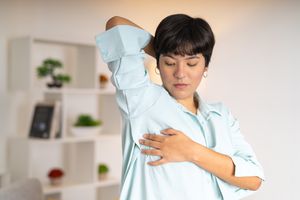 Woman doing a self breast exam