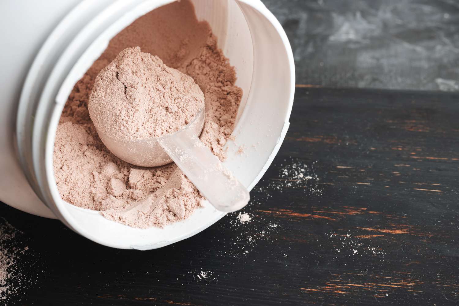 scoop of protein powder in jar