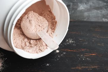scoop of protein powder in jar