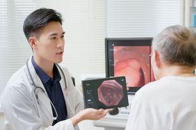 Doctor explaining hemorroids