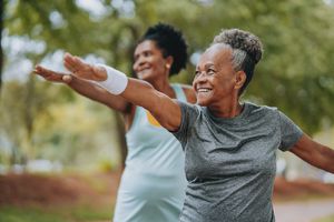 Two older people exercising together