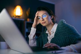 Businesswoman working late at home