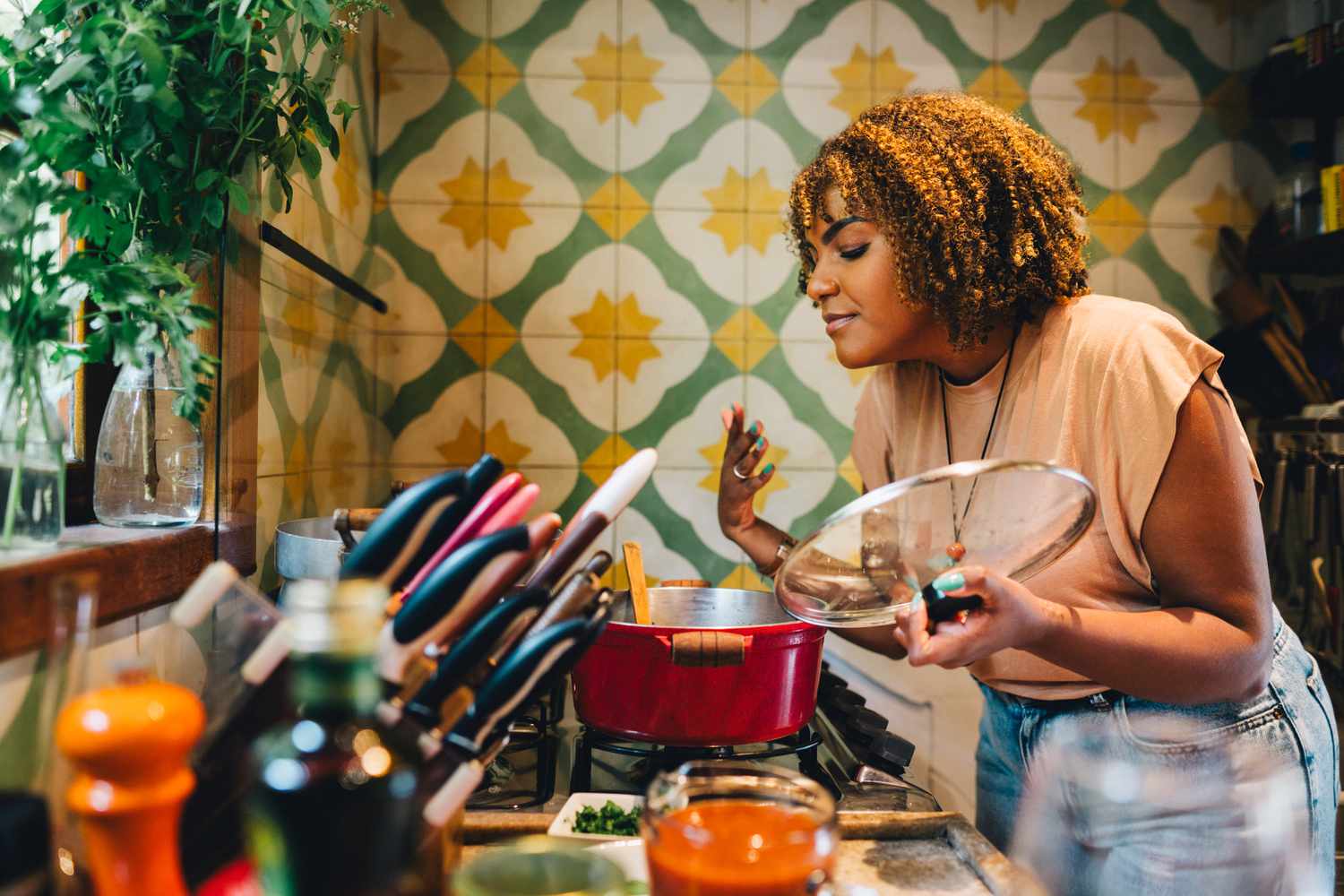 Person with PCOS cooking a healthy meal to support weight loss
