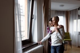 Daughter embracing her mother, a cancer patient.