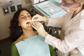 Dentist examining patient teeth, elevated view 
