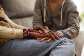 a woman holding hands with someone
