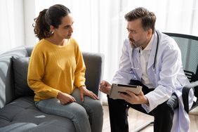 female patient talking to doctor